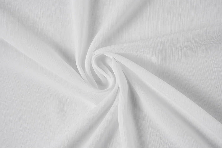 White textured fabric with a subtle crinkle or linen-like weave, arranged in a central swirl drape.