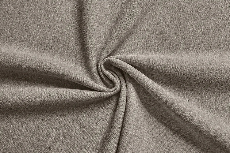A close-up of draped heather gray fabric arranged in a spiral, showing its soft texture and drape.