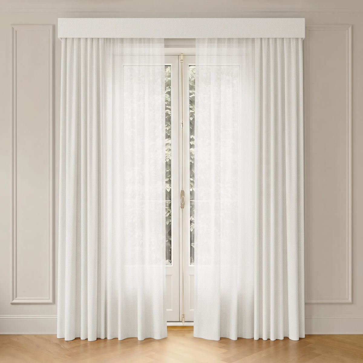 White sheer curtain panels hanging from a white rod, framing a tall window in a beige paneled room with a light wood floor.