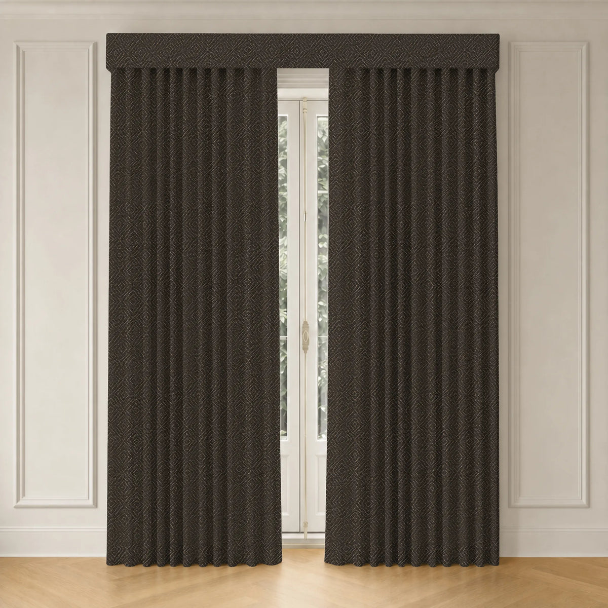 A pair of dark brown textured window curtains hanging on a rod, framing a tall window in a room with white paneled walls and light wood flooring.