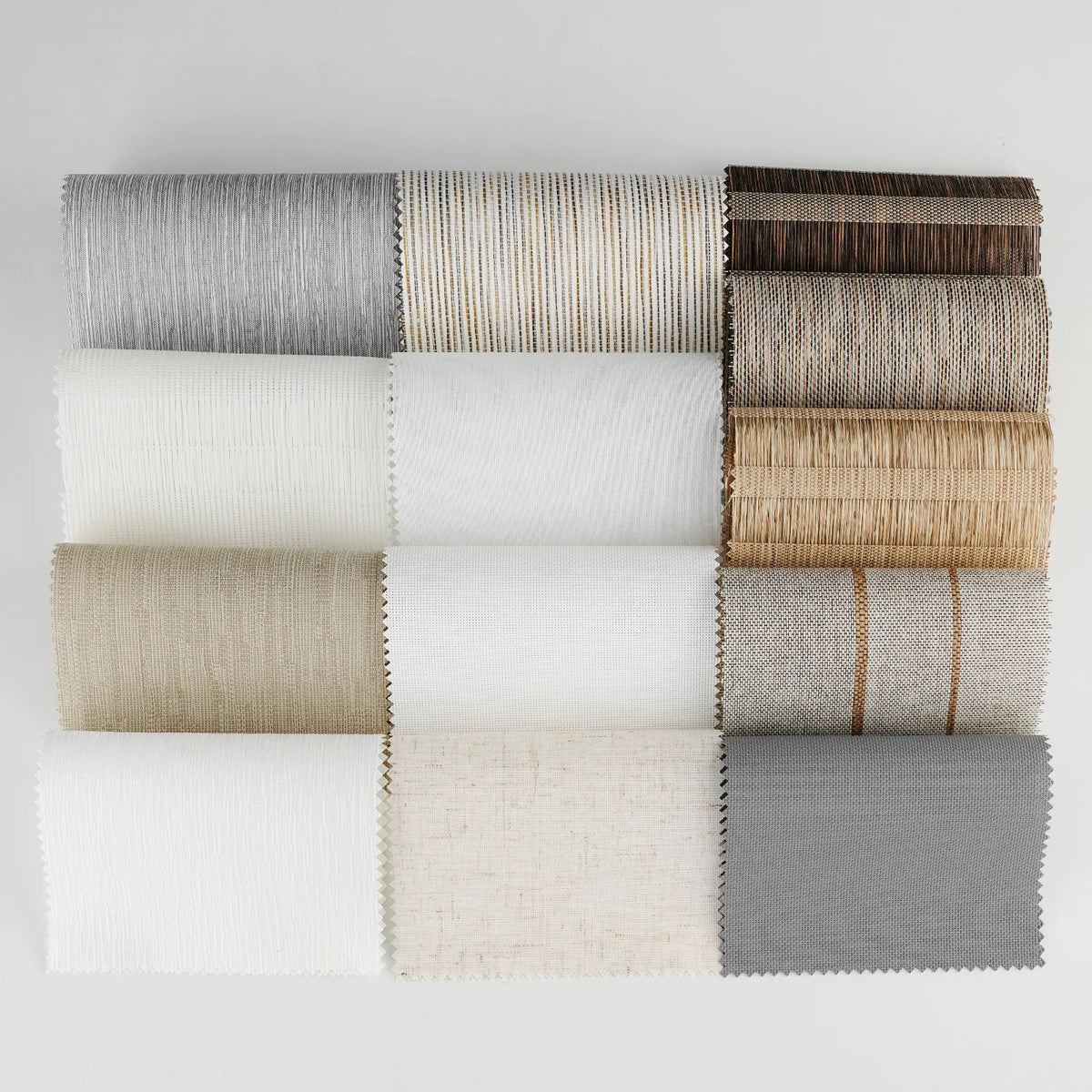 Twelve fabric swatches arranged in a 3x4 grid on a light gray background, showing various textures and colors including gray, beige, white, brown, and charcoal.