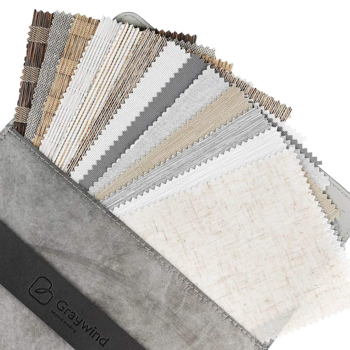 Graywind fabric swatch book showing multiple woven and textured material samples in neutral tones of beige, gray, white, and brown, with a gray cover and a black branded strap.