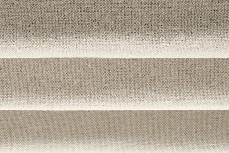 Close-up of Cadence Weave Oatmeal room-darkening fabric for flat roman shades, showing oatmeal woven texture.