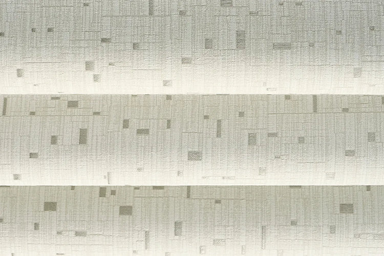 Close-up of Silver Gleam White room-darkening fabric for flat roman shades, showing white fabric with a subtle geometric pattern.