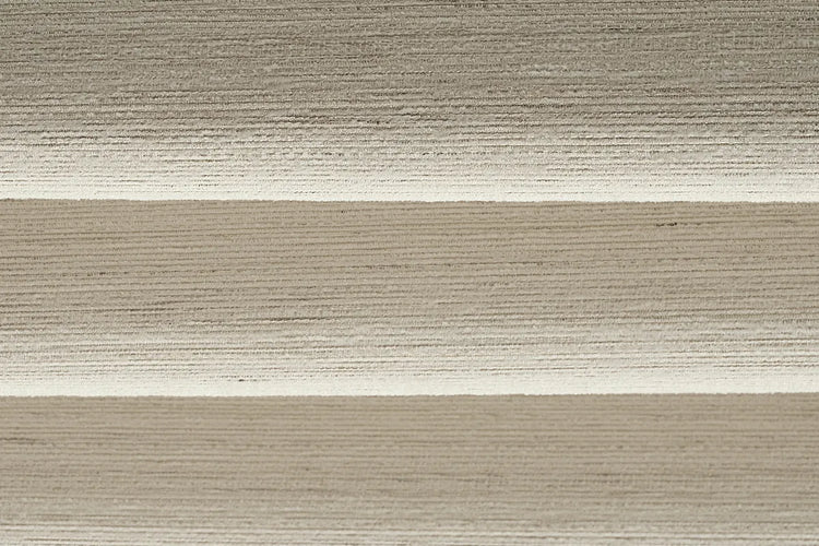 Close-up of Gilded Cream light-filtering fabric for flat roman shades, showing cream fabric with a fine horizontal texture.