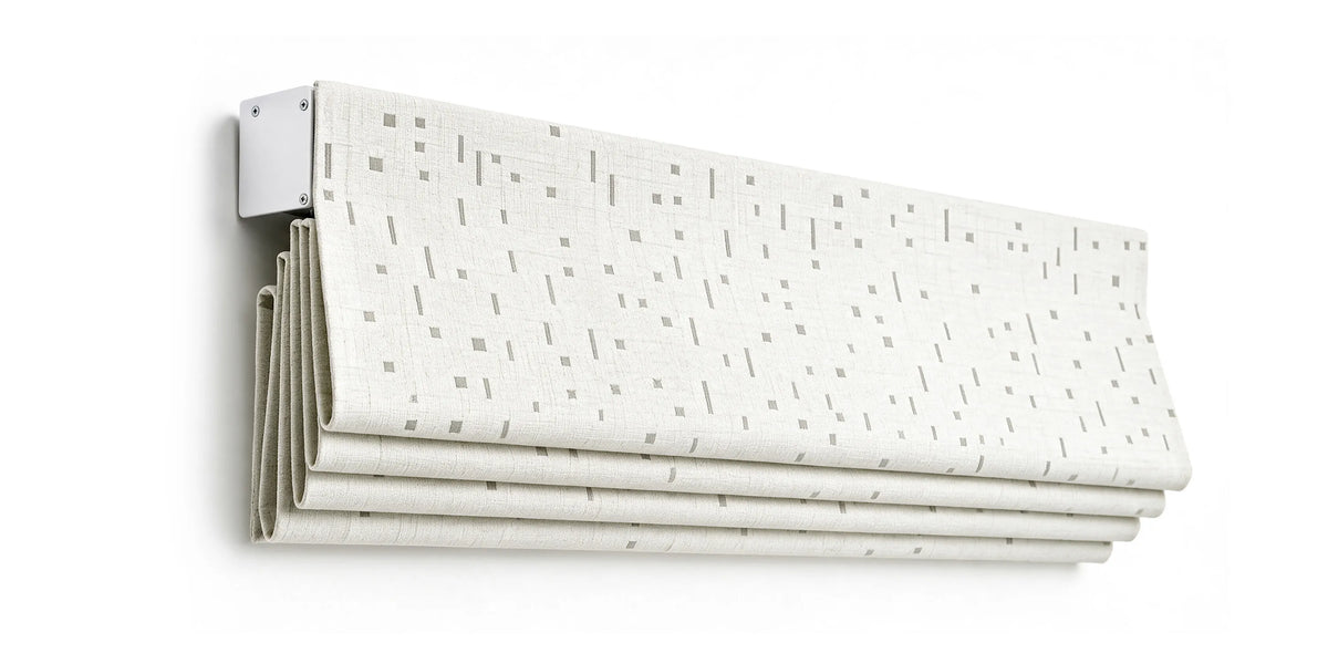 Angled view of a raised flat roman shade, showing stacked fabric and headrail.