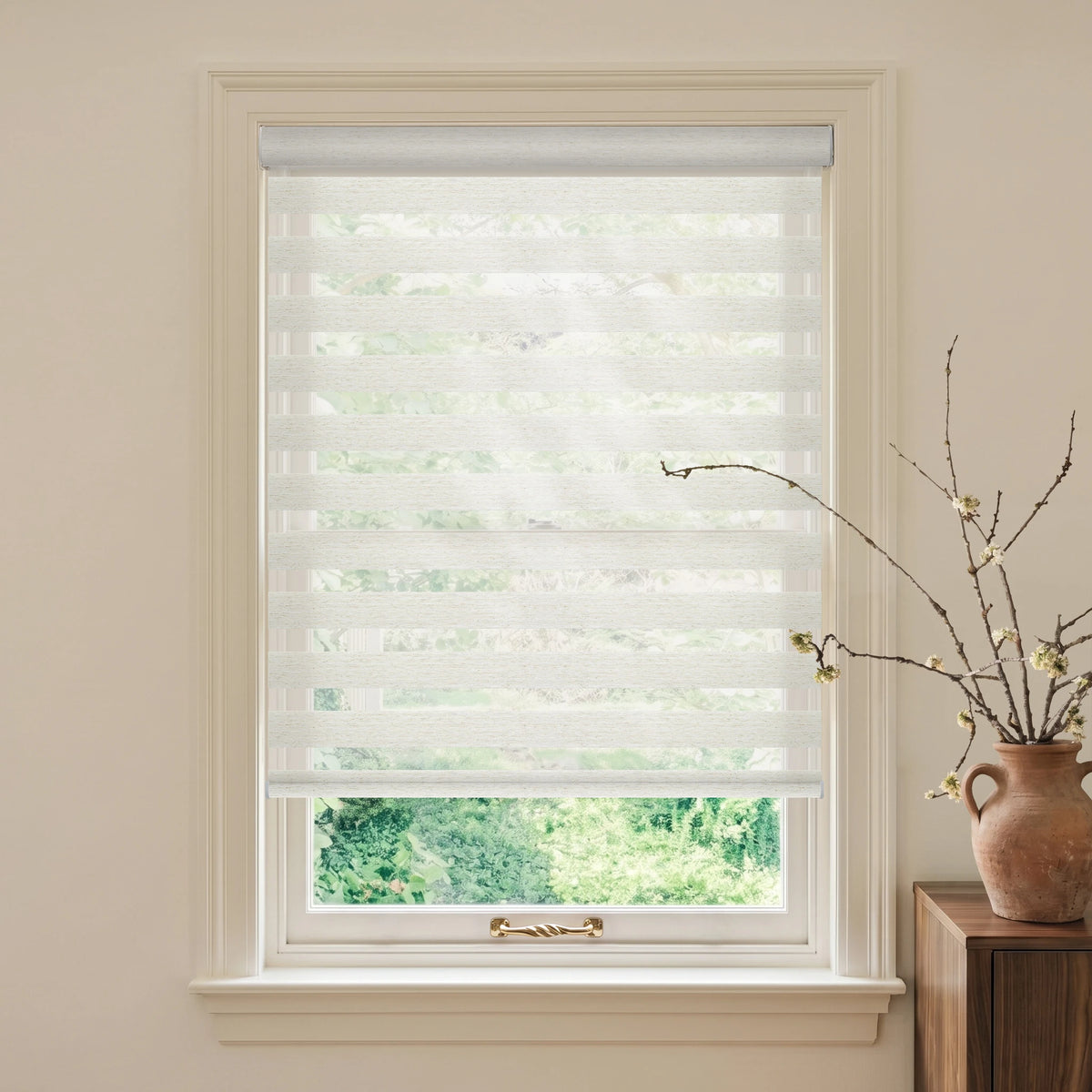 Linen Weave Beige motorized light-filtering zebra blind in a warm room beside a wooden table and terracotta vase.