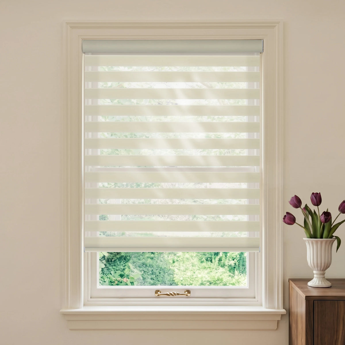 Wool-like Beige motorized light-filtering zebra blind in a styled room beside a wooden table and purple tulips.
