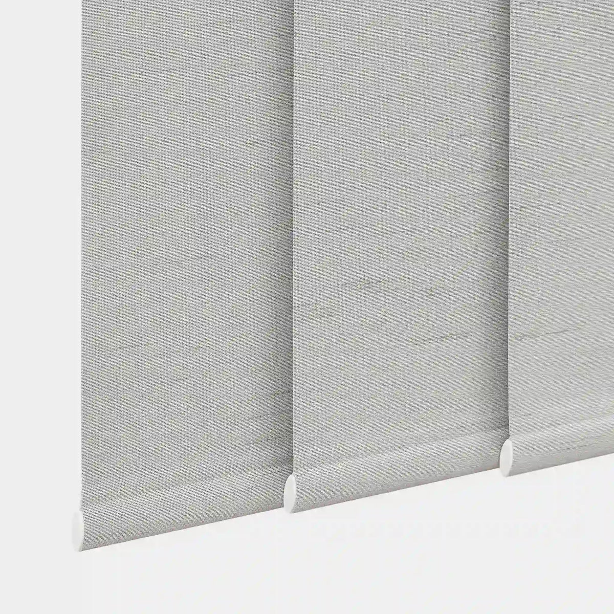 close-up of light gray fabric panels with clean weighted bottom bars
