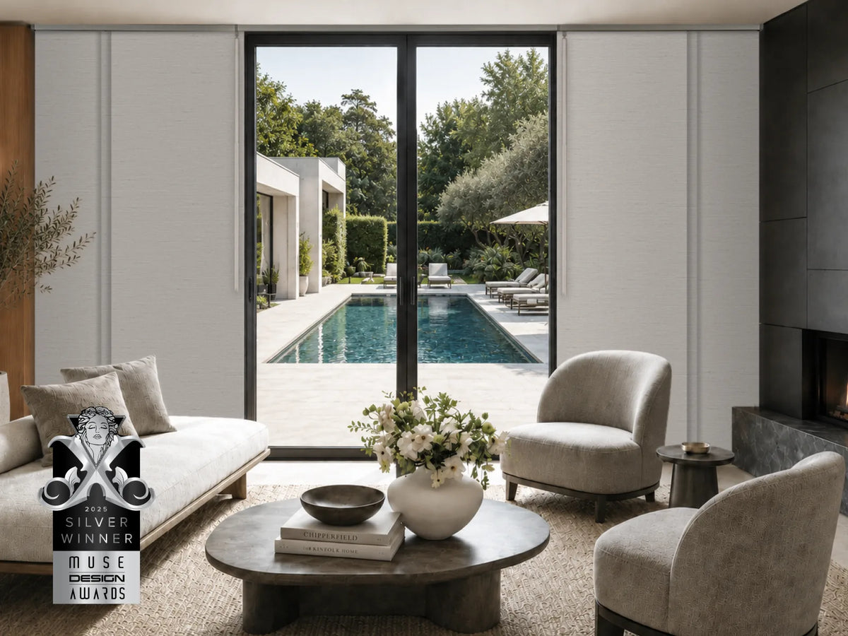 gray panel track blinds framing large patio doors in a bright living room with pool view