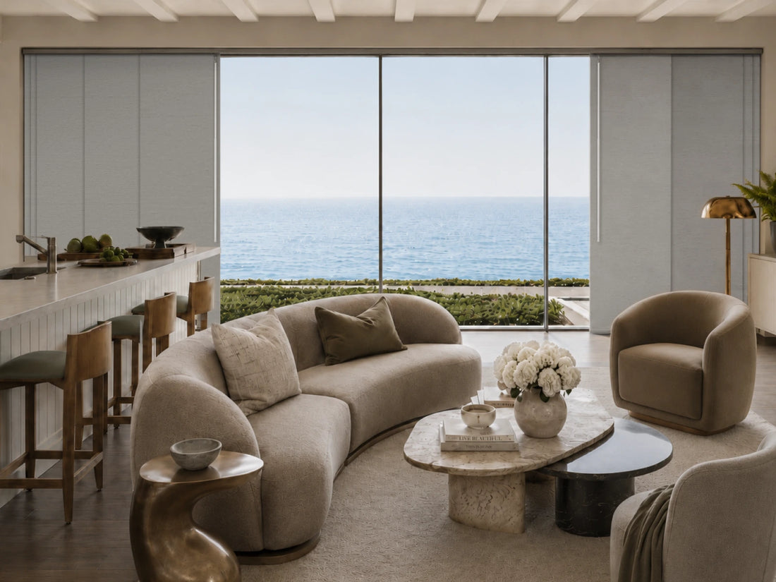 gray panel track blinds covering wide floor-to-ceiling windows in a coastal living room