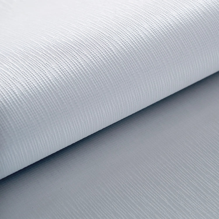 close-up of Linea White blackout fabric with crisp white vertical weave