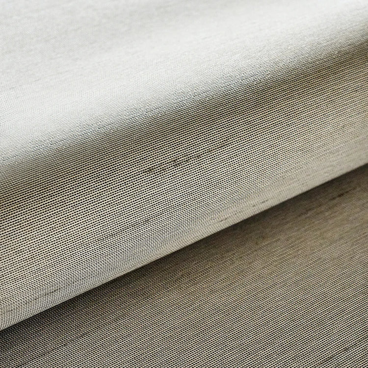 close-up of Horizon Sand blackout fabric with beige woven texture