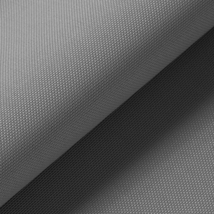 Close-up of a gray woven fabric texture with a folded corner revealing the material surface.