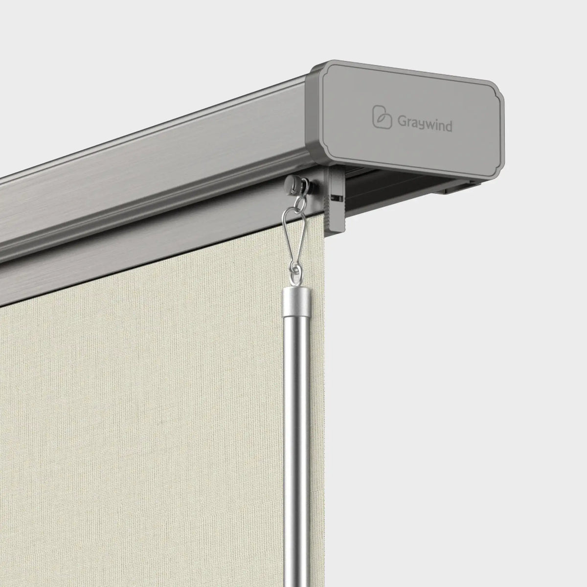 Close-up of a Graywind retractable screen curtain rail with a beige textured fabric roller and a silver metal hanging pole against a light gray background.