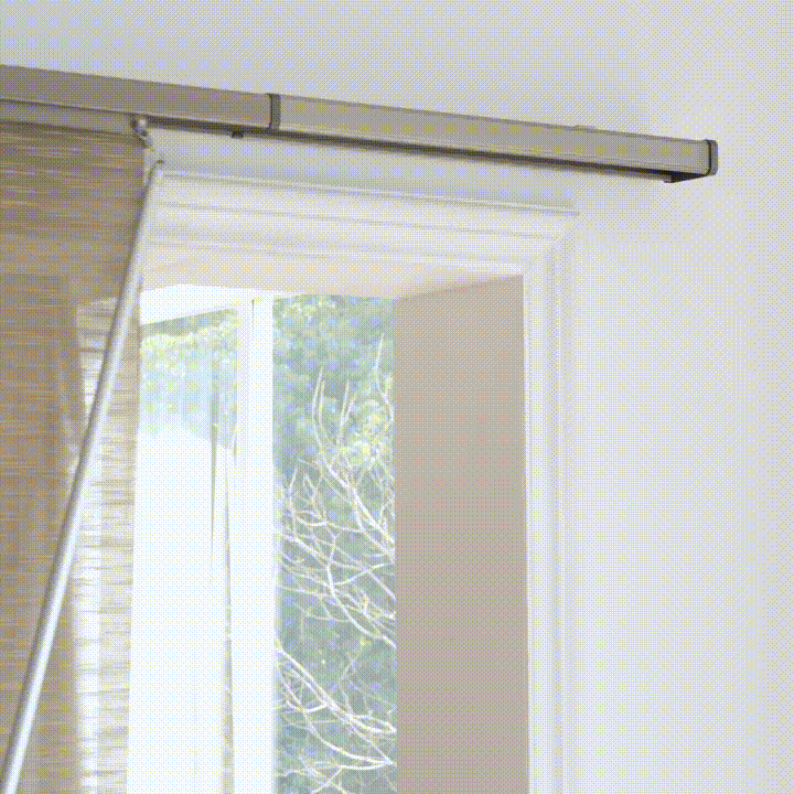 The manual panel track blinds glide smoothly across the track, providing flexible coverage for large windows and sliding glass doors.