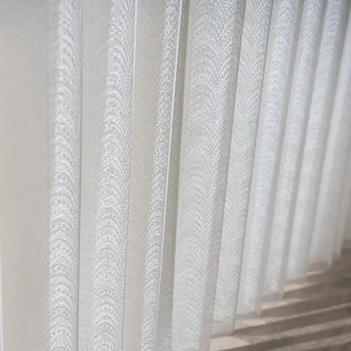 Soft polyester panels create a graceful, full-height look that feels lighter and more refined than conventional vertical blinds.