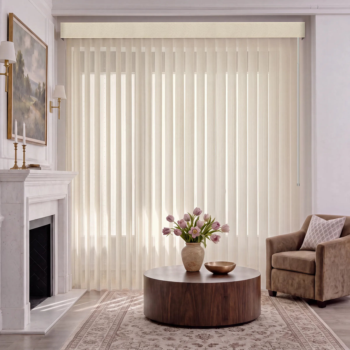 A living room scene with beige manual Sheer Vertical Blinds covering a large window, styled with a wooden sideboard, chairs, a round mirror, and a vase of tulips on the table.