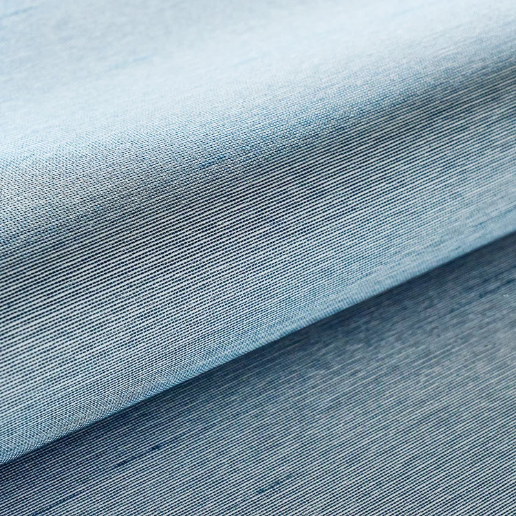 Close-up of blue fabric with a textured pattern