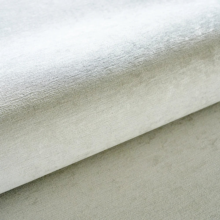 Close-up of textured beige fabric with a slight sheen