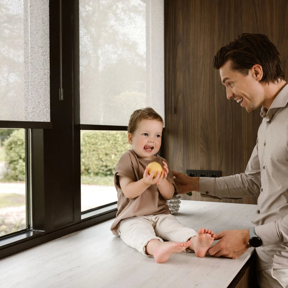 Graywind x Motionblinds smart shades with cordless motorized control for a safer family home.