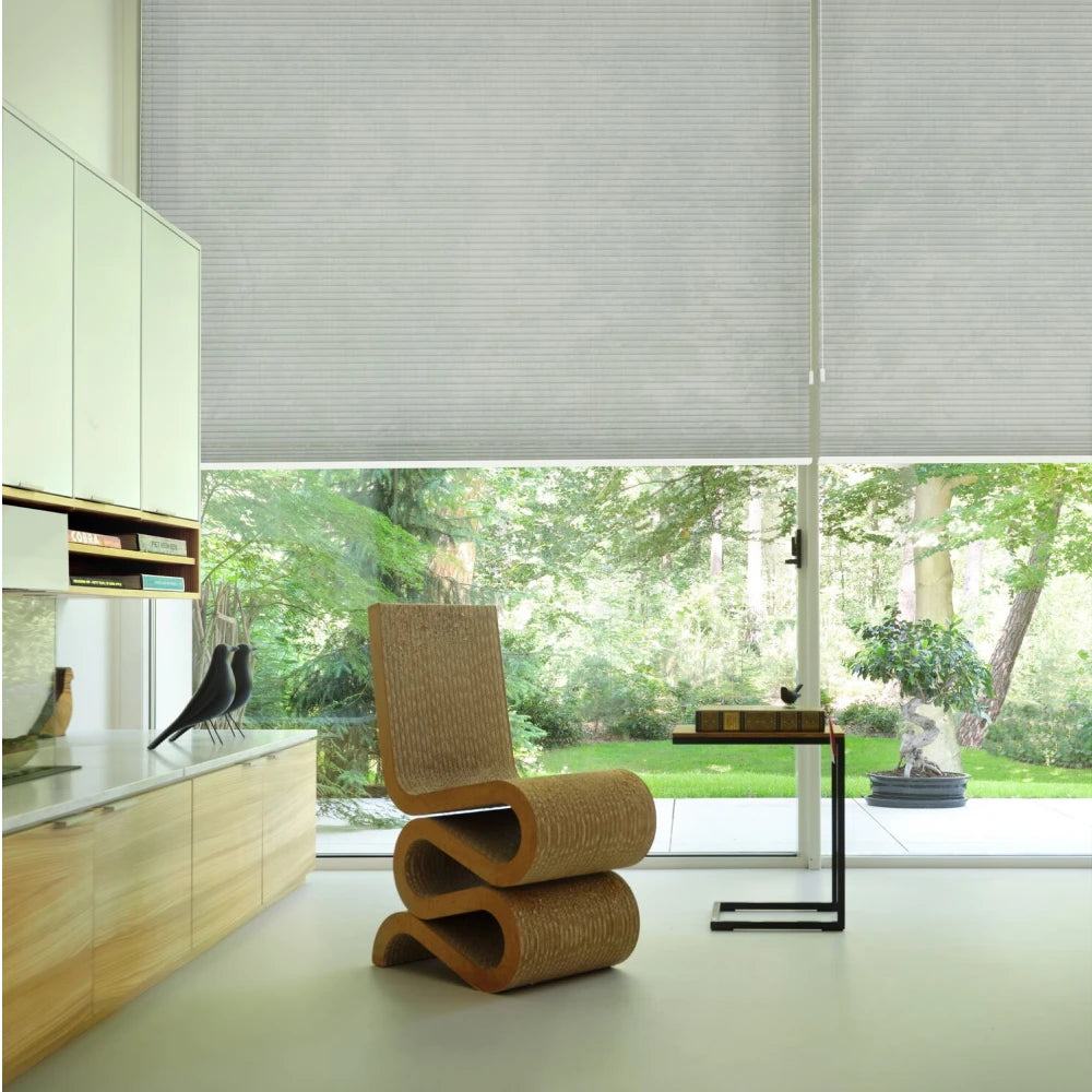 Graywind x Motionblinds cellular shades with smart motorized control for soft natural light and comfort.