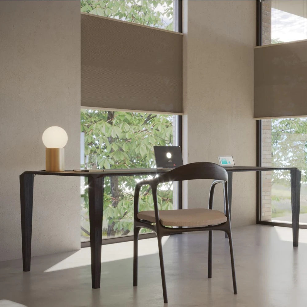 Graywind x Motionblinds smart shades bringing motorized light control to a refined home office.