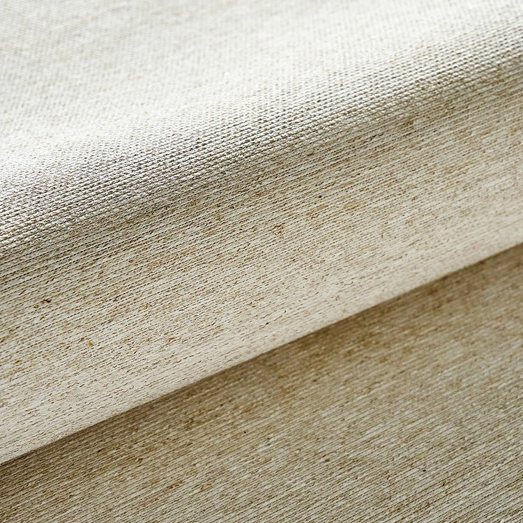 Close-up of beige fabric with a textured pattern