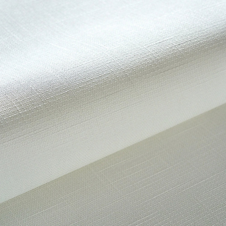Close-up of textured white and beige fabric swatches