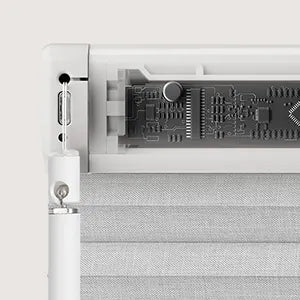 Close-up of a computer motherboard with a cooling fan on a white background