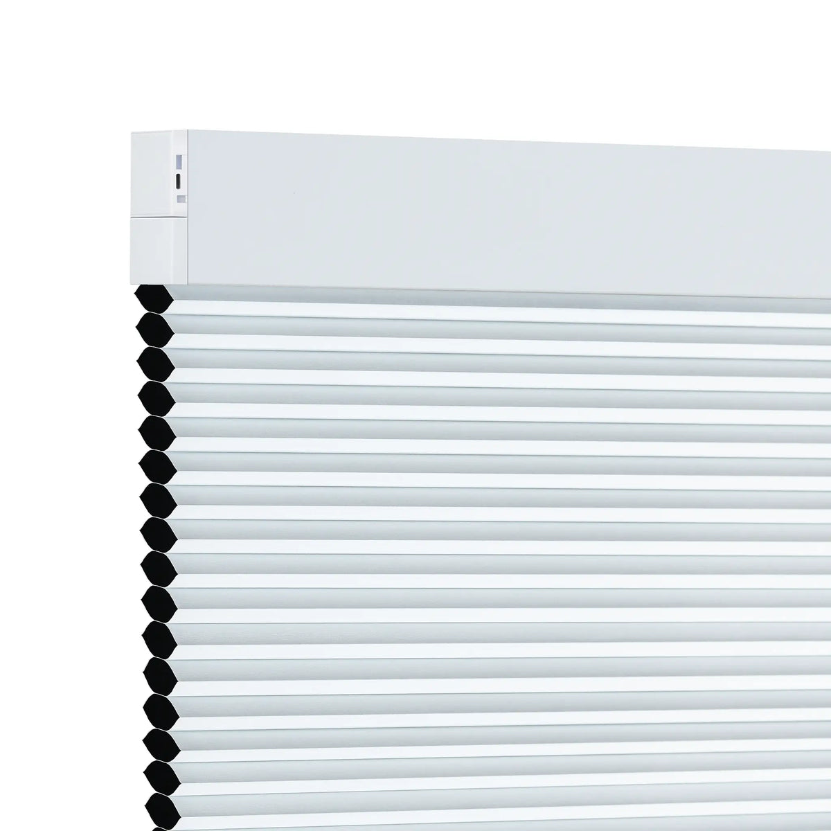 A close-up of a white motorized cellular shades