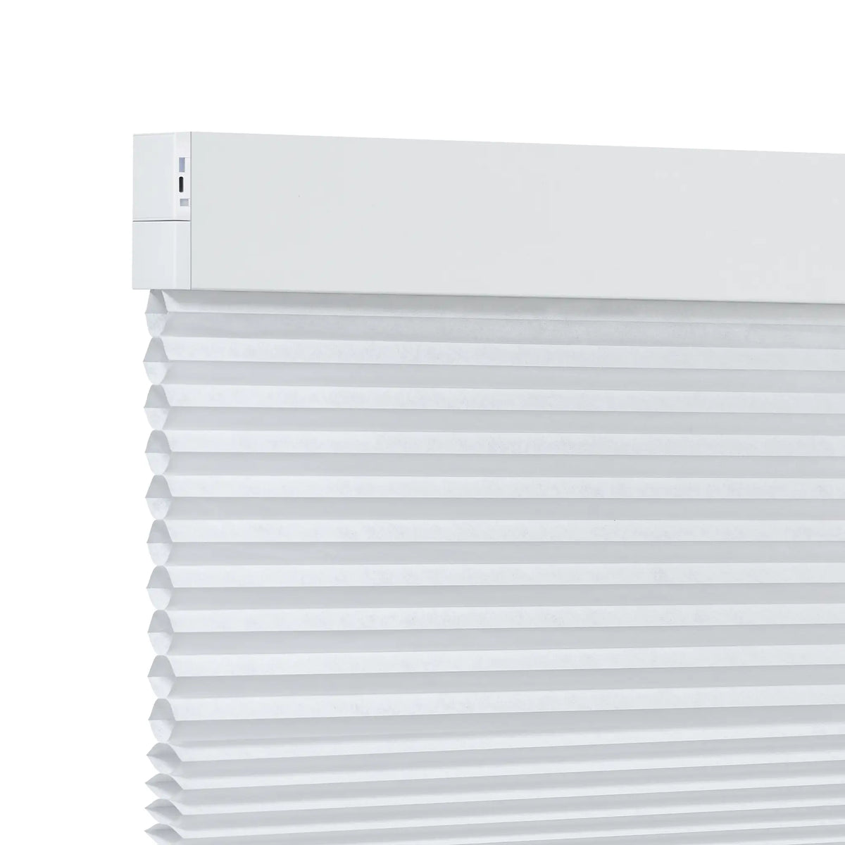 White light filtering cellular shades with a horizontal top rail, shown partially rolled down against a plain white background.