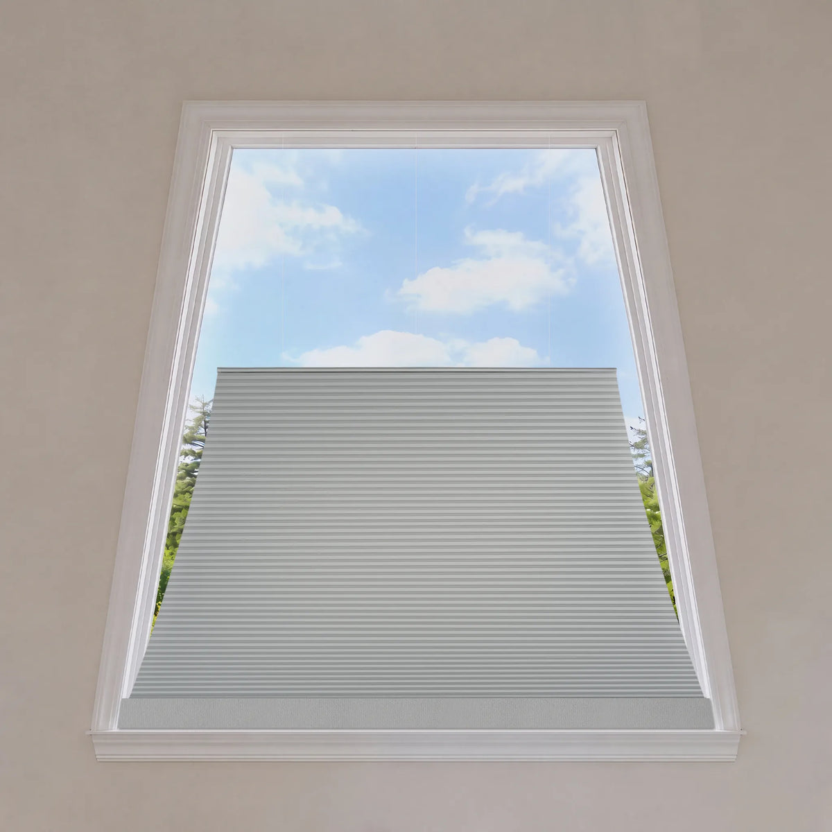 Smart window blind system with remote control and smartphone app in a living room setting.