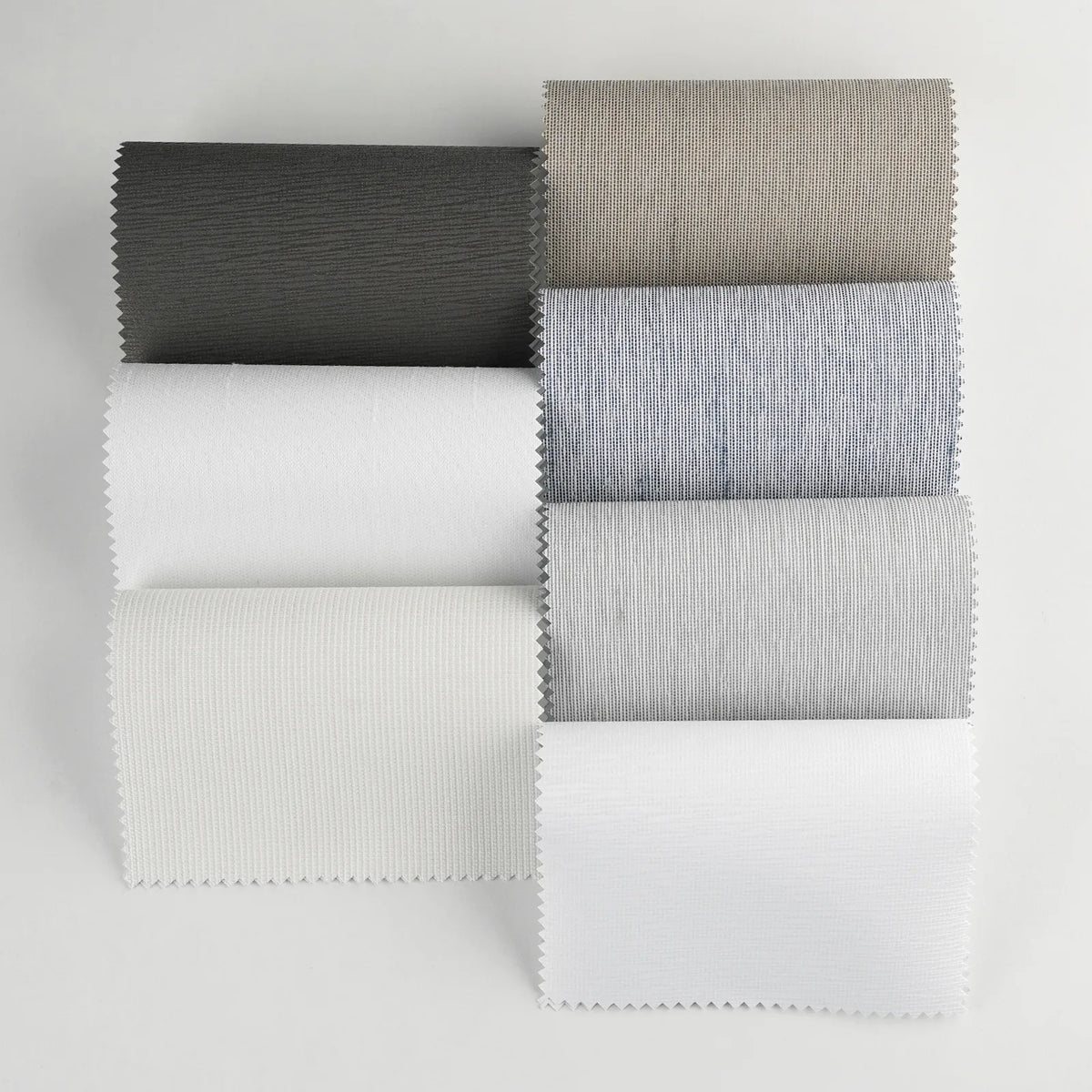 Premium Blackout Panel Track Blinds fabric samples showing available color choices