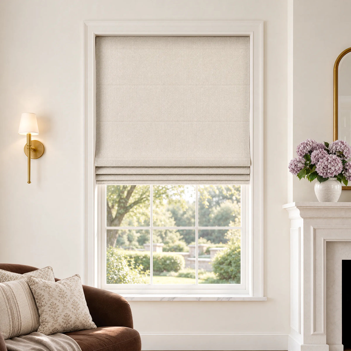 Plain fold Roman shades in Cadence Weave Oatmeal room-darkening fabric, partially raised on a window.