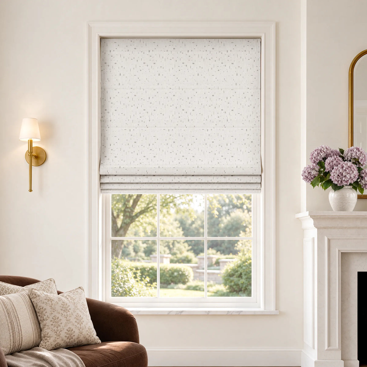 Plain fold Roman shades in Silver Gleam White room-darkening fabric, partially raised on a window.