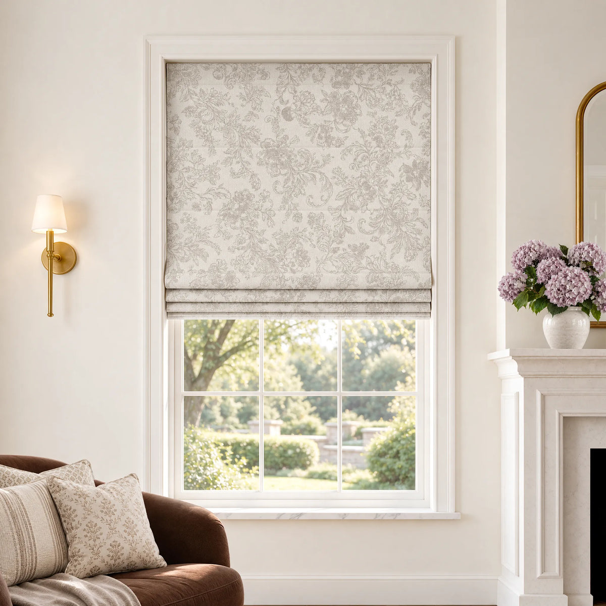 Plain fold Roman shades in Bloom Beige room-darkening fabric, partially raised on a window.