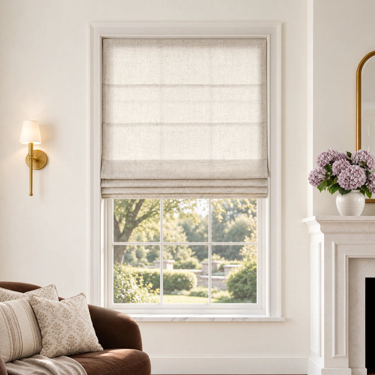Plain fold Roman shades in Hush Beige light-filtering fabric, partially raised on a window.