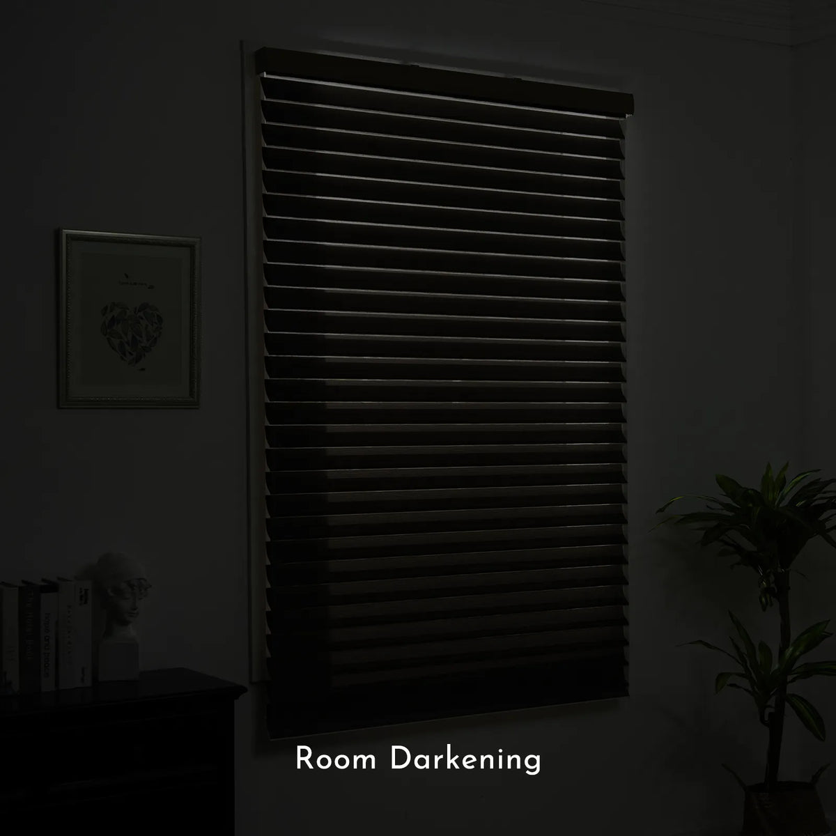 A dark window shade or blind system installed on a wall in a dimly lit room, with the text 'Room Darkening' overlaid at the bottom.