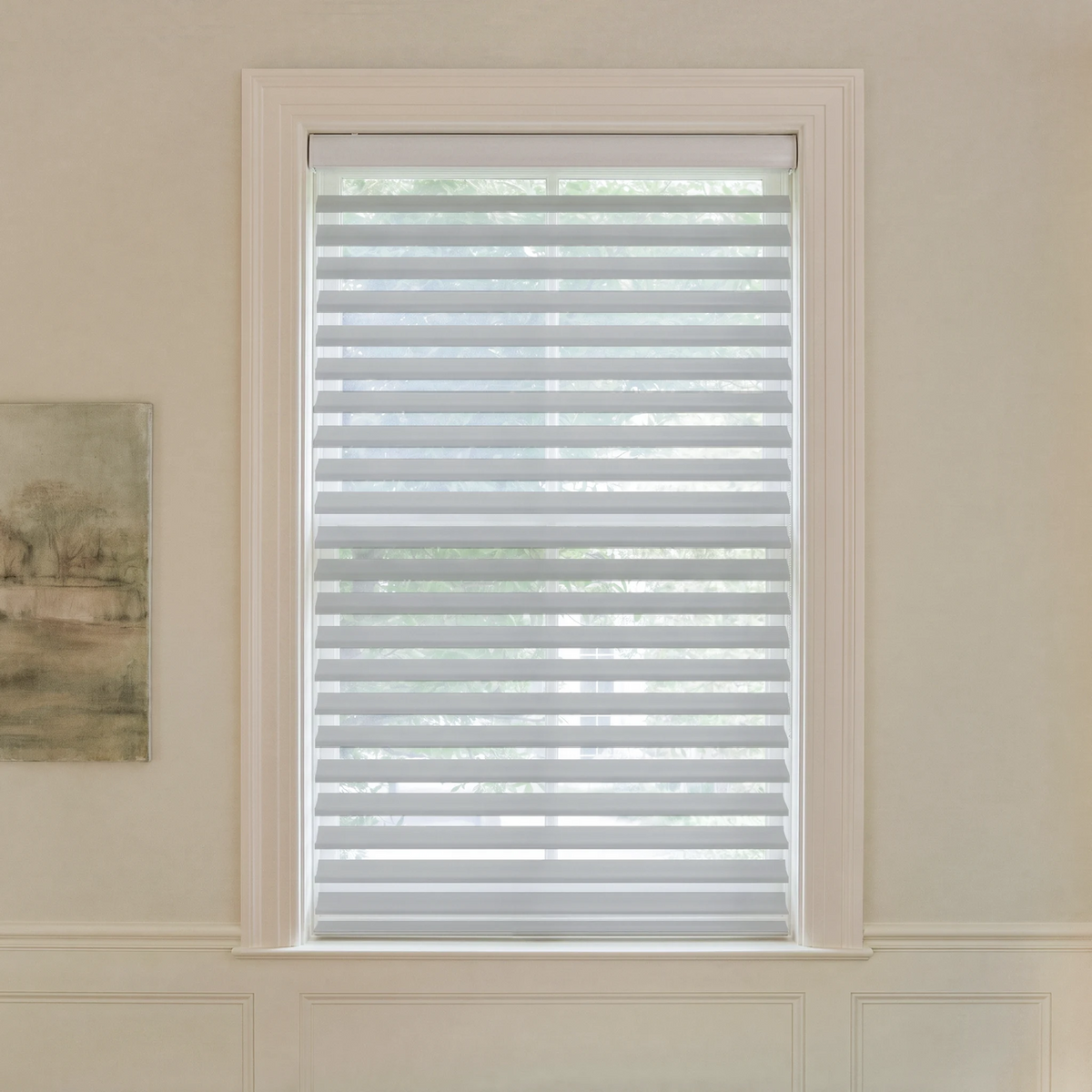 Graywind motorized light-filtering Shangrila shades in 2-inch gray fabric.