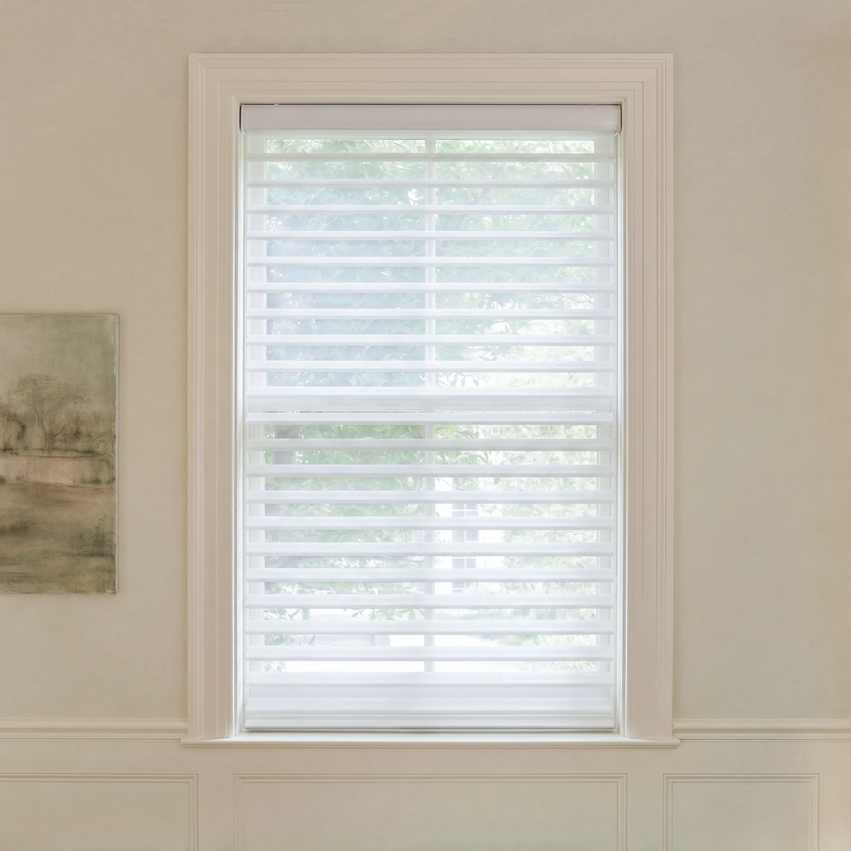Graywind motorized light-filtering Shangrila shades in 2-inch white fabric.