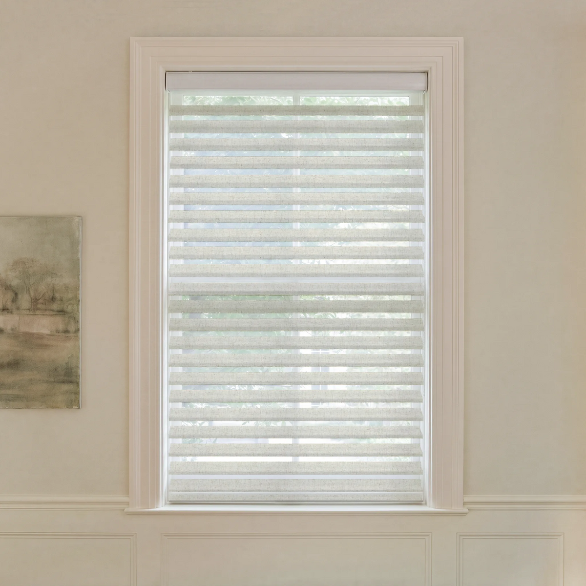 Graywind motorized light-filtering Shangrila shades in 3-inch linen beige fabric.