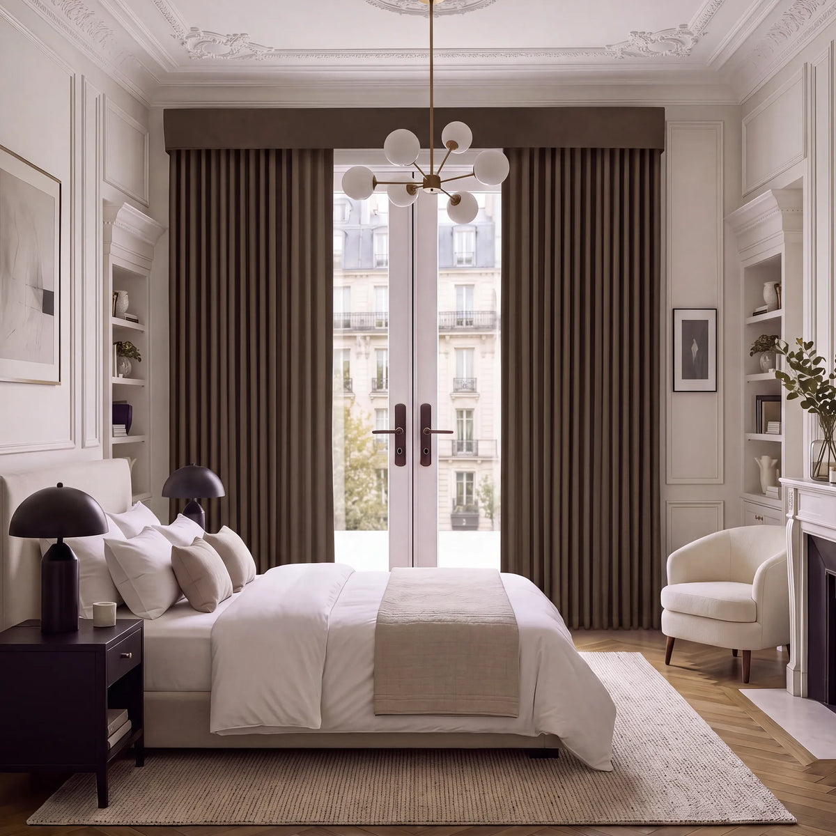 A luxury bedroom featuring floor-length brown pleated curtains with a matching valance, styled in a classic Parisian-inspired room with white bedding, a modern chandelier, and a fireplace.