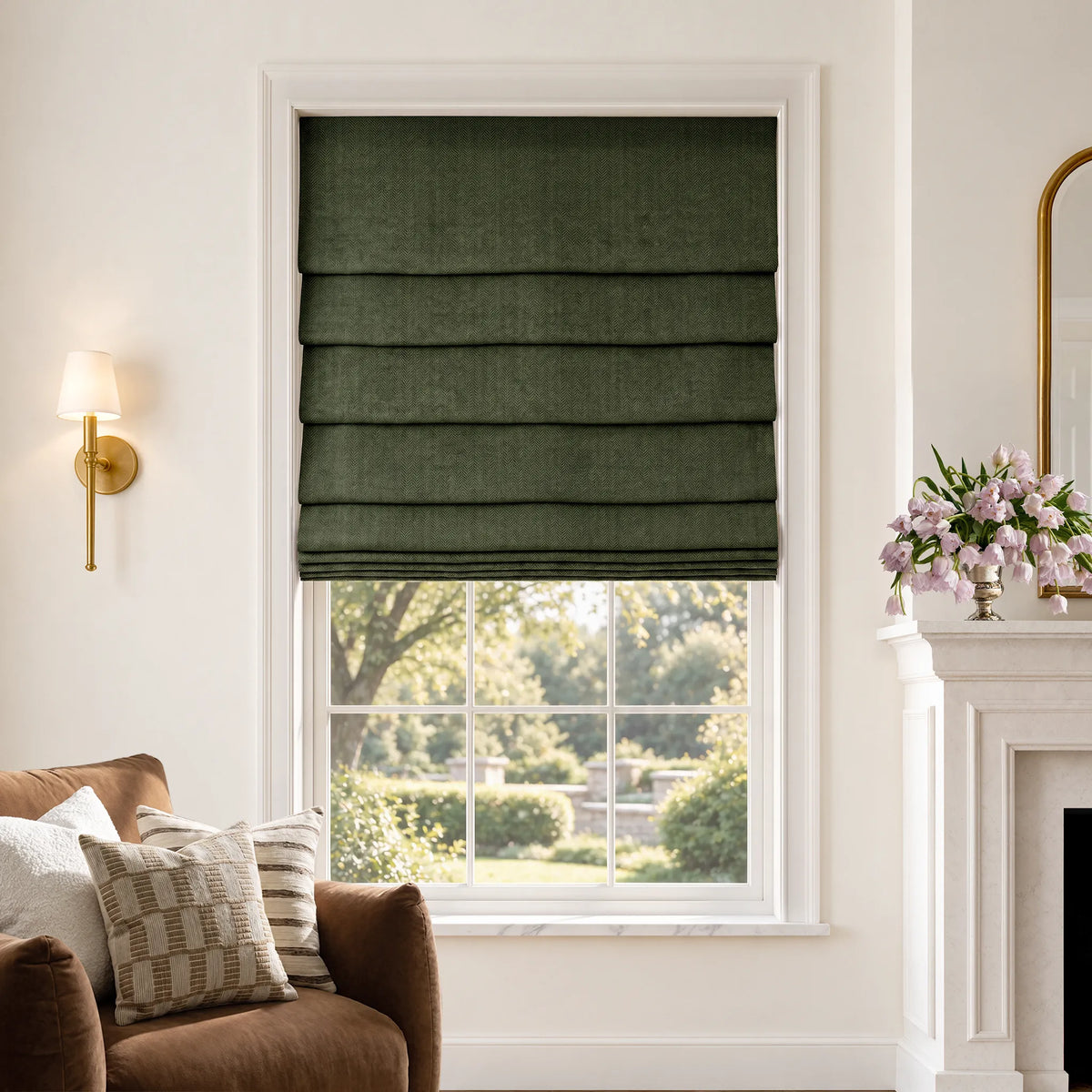 Soft fold Roman shades in Lush Moss blackout fabric, partially raised to show cascading folds.