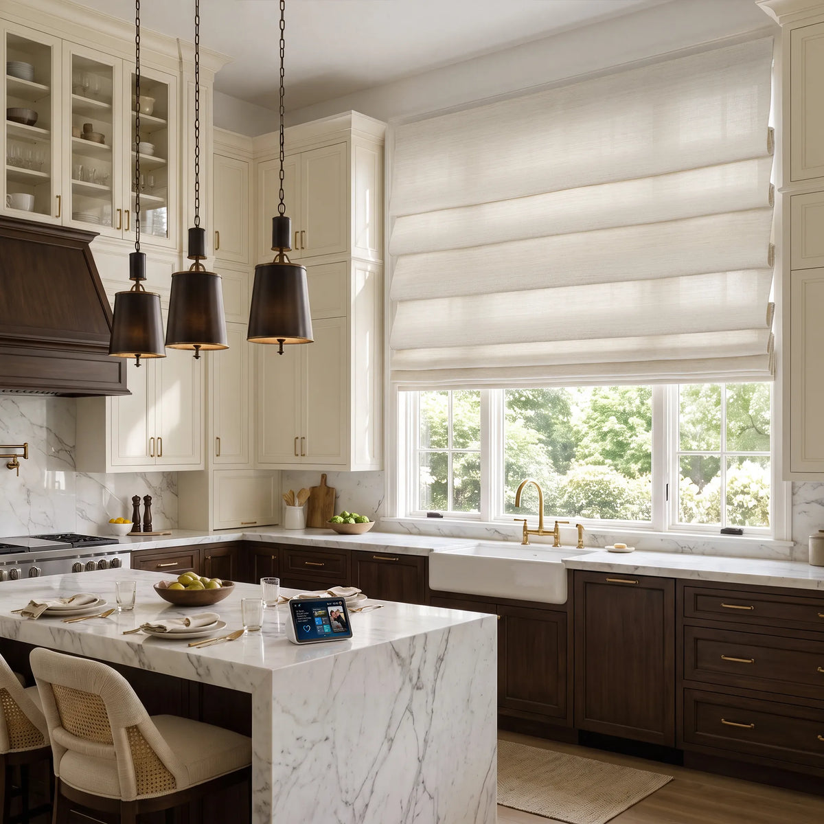 Soft fold Roman shades above a kitchen sink, with a smart display on the island.