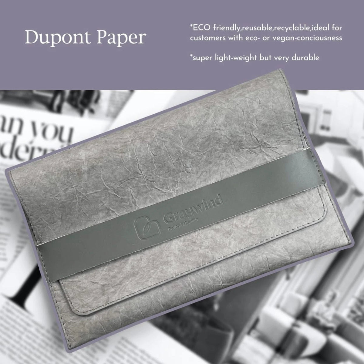 Gray clutch bag made of Dupont Paper with Greenwind branding on a newspaper background