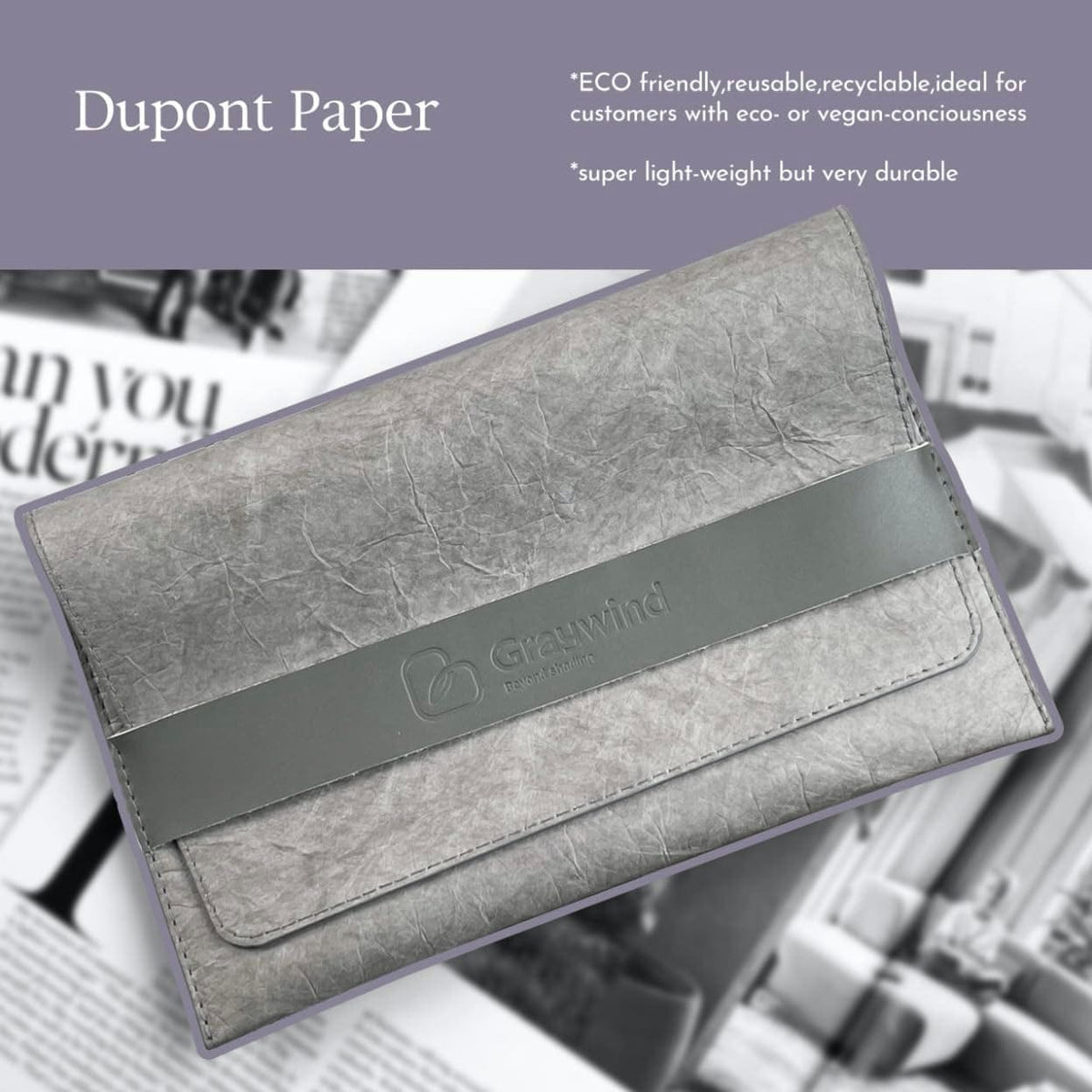 Gray clutch bag made of Dupont Paper with Greenwind branding on a newspaper background